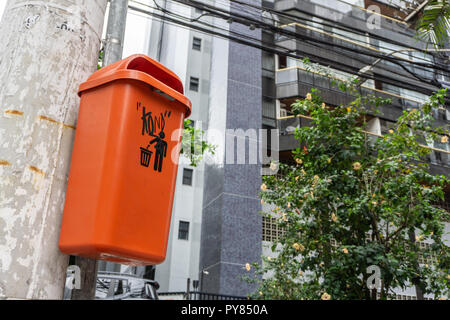 Orange Trash Can in the Streets Stock Photo