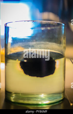 Pumice stone is floating on the water. Pumice has an average porosity of 90%, and initially floats on water. Pumice varies in density according to the Stock Photo