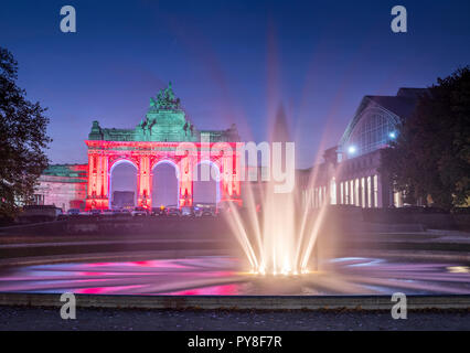Brussels, The Triumfal arch (Parc du Cinquantenaire) red illuminated in the night Stock Photo