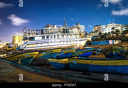 A photo of Old wooden boats at Gaza seaport, Night photo. Stock Photo