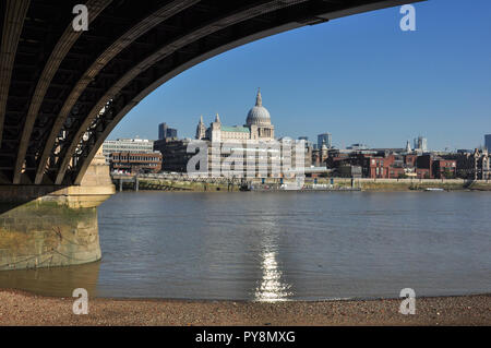 North bank and St Paul's Cathedral from under the arch of Blackfriar's railway station bridge, London, England, UK Stock Photo