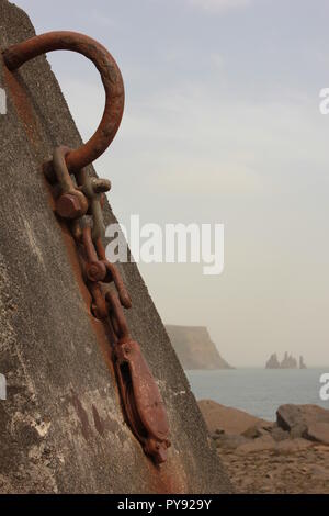 A block and tackle chained to a concrete slab on a beach in Iceland Stock Photo