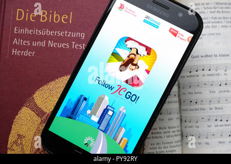 Vatican releases the smartphone app 'Follow JC GO!' (Follow Jesus Christ), which is almost identical to the model Pokémon Go. Instead of monsters, saints are now being sought and catched in the Vatican game. The game is currently only available in Spanish, other language versions will be released shortly. Photo shows login page of 'Follow JC GO!' on a smartphone. Stock Photo