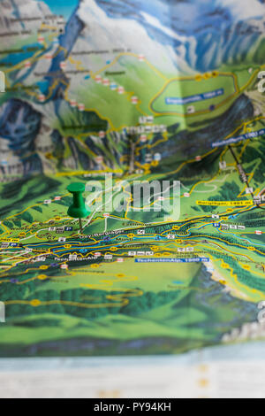 green pin marks a location of a destination on a map, switzerland Stock Photo