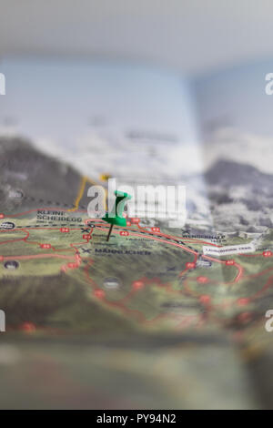 green pin marks a location of a destination on a map, switzerland Stock Photo
