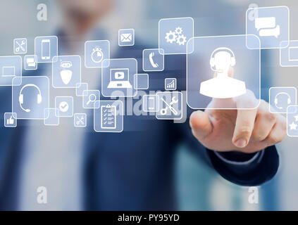 Technical support concept, business person touching helpdesk icon on screen, hotline assistance service available by phone, chat, email or online to s Stock Photo