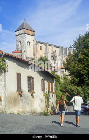 Tourists visiting the village Saint-Bertrand-de-Comminges, Haute-Garonne, Pyrenees, France Stock Photo