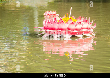 Beautiful pink kratong is floating on the water. Conccept for loy kratongs festival celebrated in Thailand. Stock Photo