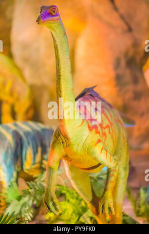 Cute model of Gallimimus dinosaur in the public museum. Gallimimus is a genus of ornithomimid theropod dinosaurs from the late Cretaceous period. Stock Photo