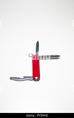 Small Swiss army knife close up isolated against white backdrop Stock Photo