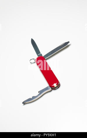 Small Swiss army knife close up isolated against white backdrop Stock Photo