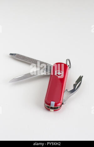 Small Swiss army knife close up isolated against white backdrop Stock Photo
