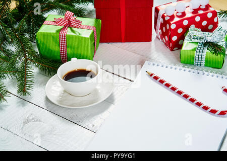blank letter to santa and a pencil on an old white wooden table with christmas decorations Stock Photo