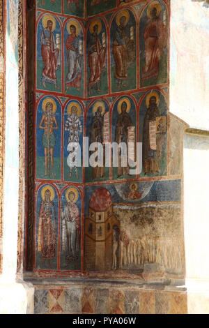 Frescoes on exterior of Voronet Monastery Church, painted using Voronet Blue paint, part of the Bucovina Monastery group in Romania Stock Photo