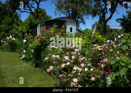 shepherds hut in English Garden,England,Europe Stock Photo