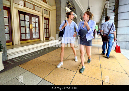 Two young women walking through the Ritz Arcade on Piccadilly, London, England, UK. Stock Photo