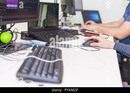 Software developer, programmer or coder working on computer in an IT office. Stock Photo