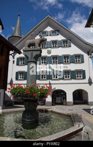 Water fountain off Gotthardstrasse, Andermatt, Switzerland Stock Photo