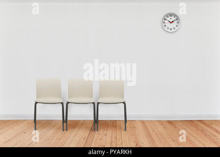 empty waiting room with chairs and clock Stock Photo