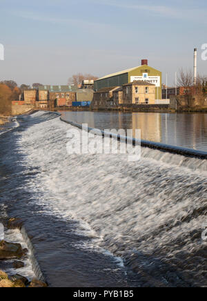 The weir and paper mill in Otley, West Yorkshire Stock Photo