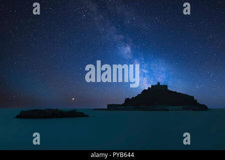 Stunning vibrant Milky Way composite image over landscape of St Michael's Mount Bay Marazion Cornwall England Stock Photo