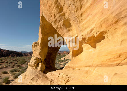 NV00046-00...NEVADA - A window through the Aztec sandstone located in the Mojave Desert along the While Domes Loop Trail in Valley of Fire State Park. Stock Photo