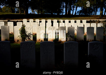 War graves in the autumn sunlight at Y Ravine cemetery near Beaumont-Hamel on the Somme battlefield in France Stock Photo