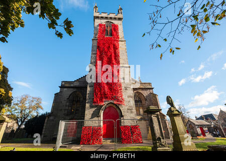 Edinburgh, Scotland, UK. 26 October, 2018. Liberton Kirk in Edinburgh is adorned with thousands of red poppies to mark the centenary of Armistice Day. The church bell tower is covered in a solid blanket of poppies made by the congregation. Credit: Iain Masterton/Alamy Live News Stock Photo