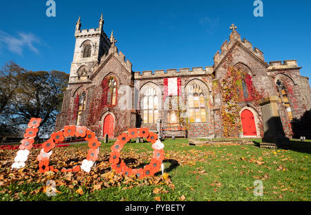 Edinburgh, Scotland, UK. 26 October, 2018. Liberton Kirk in Edinburgh is adorned with thousands of red poppies to mark the centenary of Armistice Day. The church bell tower is covered in a solid blanket of poppies made by the congregation. Credit: Iain Masterton/Alamy Live News Stock Photo