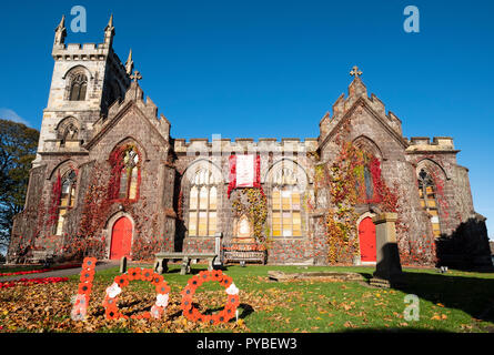 Edinburgh, Scotland, UK. 26 October, 2018. Liberton Kirk in Edinburgh is adorned with thousands of red poppies to mark the centenary of Armistice Day. The church bell tower is covered in a solid blanket of poppies made by the congregation. Credit: Iain Masterton/Alamy Live News Stock Photo