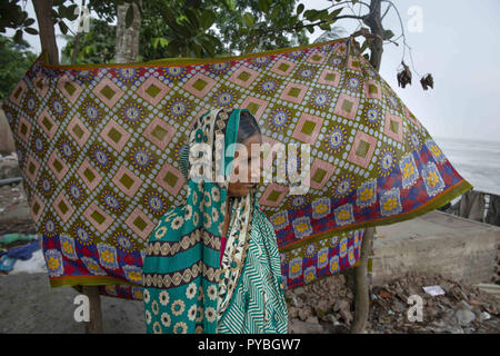 Naria, Shariatpur, Bangladesh. 14th Sep, 2018. Surjoban seen standing next to her home site after being dissolved in Padma river.Effects of Climate Change are very visual in a country like Bangladesh. In year 2018, a rapid river erosion happened around the areas beside the Padma River. Lots of people lost their homes, lands and the way of living. This rapid river erosion made many climate refugees. Credit: Ziaul Haque Oisharjh/SOPA Images/ZUMA Wire/Alamy Live News Stock Photo