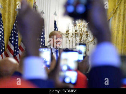 Washington DC, USA. 26th Oct, 2018. United States President Donald J. Trump arrives for the 2018 Young Black Leadership Summit in the East Room of the White House. Credit: Mike Theiler/CNP/ZUMA Wire/Alamy Live News Stock Photo