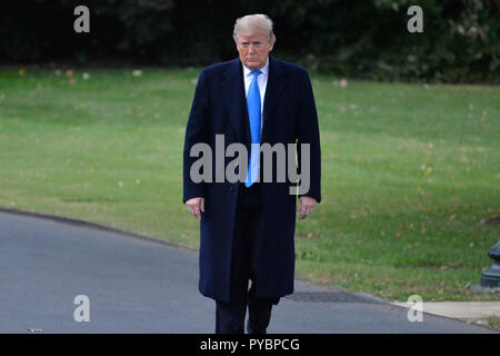 Washington DC, USA. 26th Oct, 2018. United States President Donald J. Trump answers reporter's questions prior to departing the White House, Washington, DC, for a day trip to Charlotte, North Carolina for a campaign rally, October 26, 2018, ahead of the midterm elections in November. Credit: Mike Theiler/CNP /MediaPunch Credit: MediaPunch Inc/Alamy Live News Stock Photo