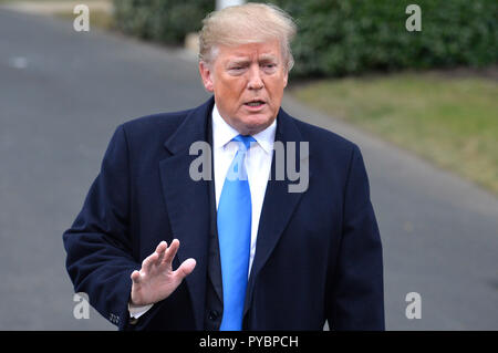 Washington DC, USA. 26th Oct, 2018. United States President Donald J. Trump answers reporter's questions prior to departing the White House, Washington, DC, for a day trip to Charlotte, North Carolina for a campaign rally, October 26, 2018, ahead of the midterm elections in November. Credit: Mike Theiler/CNP /MediaPunch Credit: MediaPunch Inc/Alamy Live News Stock Photo