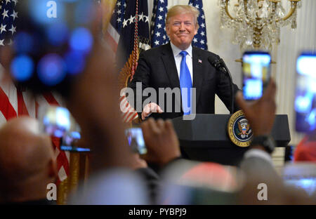 Washington DC, USA. 26th Oct, 2018. United States President Donald J. Trump arrives for the 2018 Young Black Leadership Summit in the East Room of the White House, Washington, DC, October 26, 2018. Credit: Mike Theiler/CNP /MediaPunch Credit: MediaPunch Inc/Alamy Live News Stock Photo