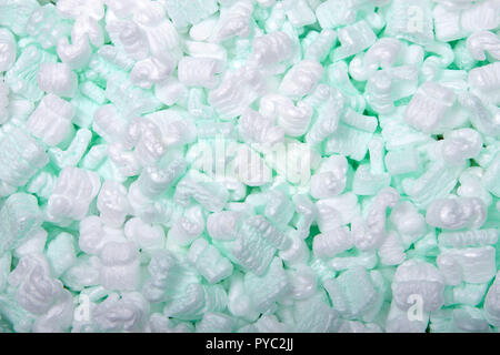 Flat lay of of foam packing peanuts. Foam peanuts, or foam popcorn, packing peanuts or packing noodles, are a common loose-fill packaging and cushioni Stock Photo