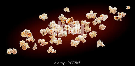 Popcorn isolated on black background. Falling or flying popcorn. Close-up Stock Photo