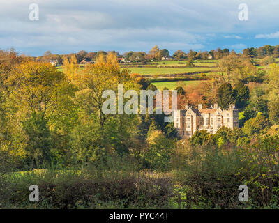 Fountains Hall amongst autumn trees from Fountains Lane near Ripon North Yorkshire England Stock Photo