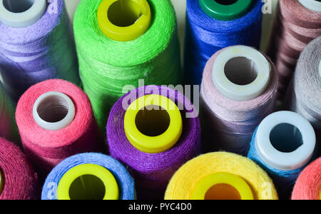 Sewing threads multicolored background closeup Stock Photo