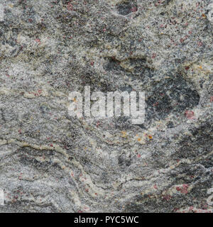 Gray texture of a stone with pink spots. Stock Photo