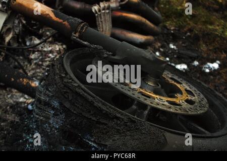 Burnt out motorcycle abandoned after Joyride Stock Photo