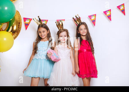 Children's funny birthday party in decorated room Stock Photo