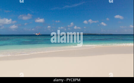 Seaplane and beach atoll island Maldives. Stock Photo