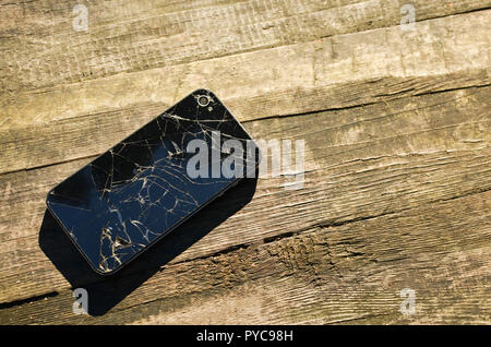 Mobile smartphone with broken screen isolated on white background with. Repair gadgets Stock Photo