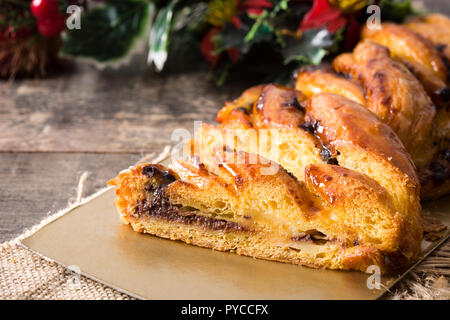 Homemade braid chocolate on wooden table. Close up Stock Photo