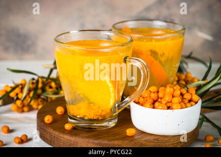 Sea buckthorn tea with orange in a glass cups. Stock Photo