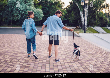 Lovely young hipster couple dating during summer sunset. Stock Photo