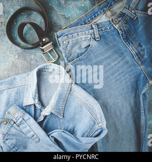 Total denim look. Blue jacket, jeans and black. Flat lay photo fashionable men's clothes Stock Photo