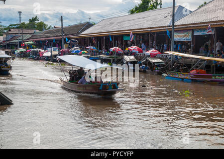 Amphawa, Thailand - Sep 13, 2015: Floating food market at Amphawa where food is cooked and prepared on the boats and serve to the people on the river  Stock Photo