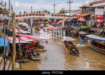 Amphawa, Thailand - Sept 13, 2015: Many boats in the water canal on floating market selling produce or transporting people. Stock Photo